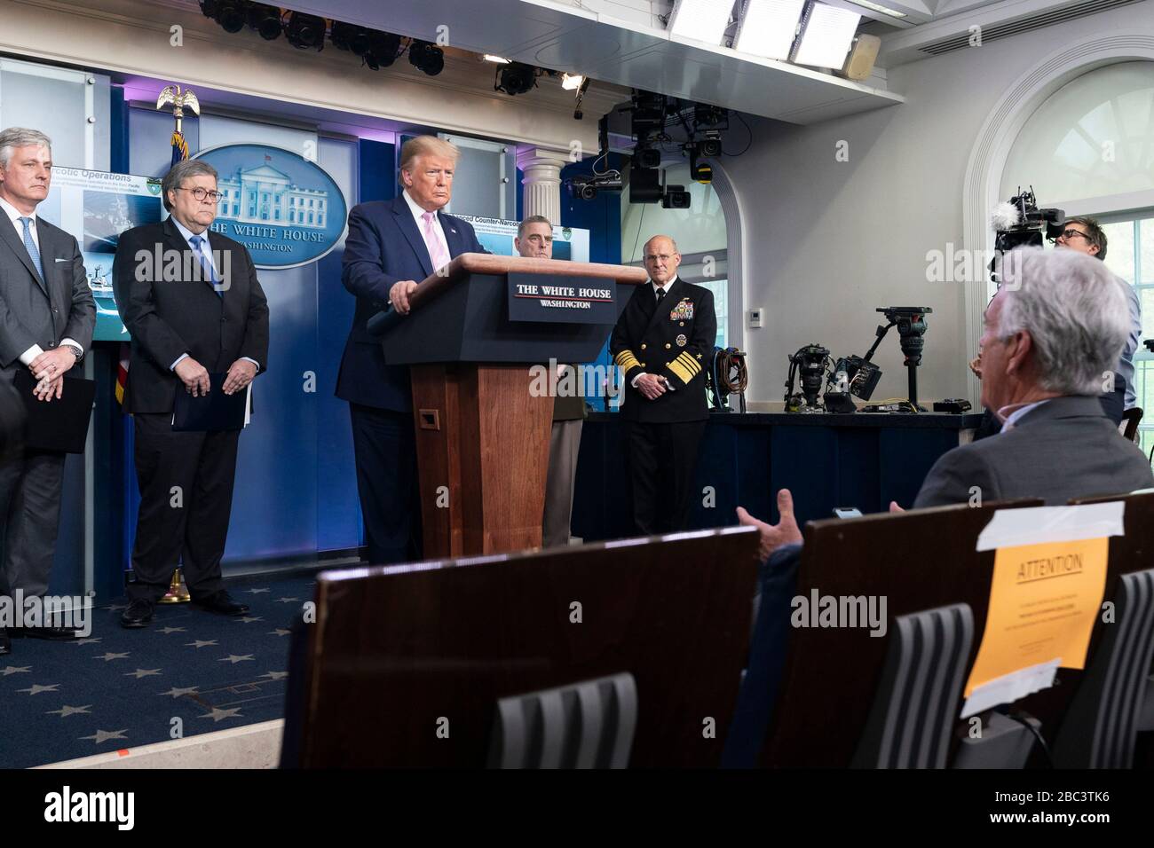 U.S President Donald Trump responds to a reporters question on enhanced counter-narcotics operations and increased border security in the Press Briefing Room of the White House April 1, 2020 in Washington, DC. Joining the president left to right are: Coast Guard Commandant Adm. Karl Schultz, National Security Advisor Amb. Robert O’Brien, Attorney William Barr, Secretary of Defense Mark Esper,  Chairman of the Joint Chiefs of Staff Gen. Mark Milley and Chief of Naval Operations Adm. Michael Gilday. Stock Photo