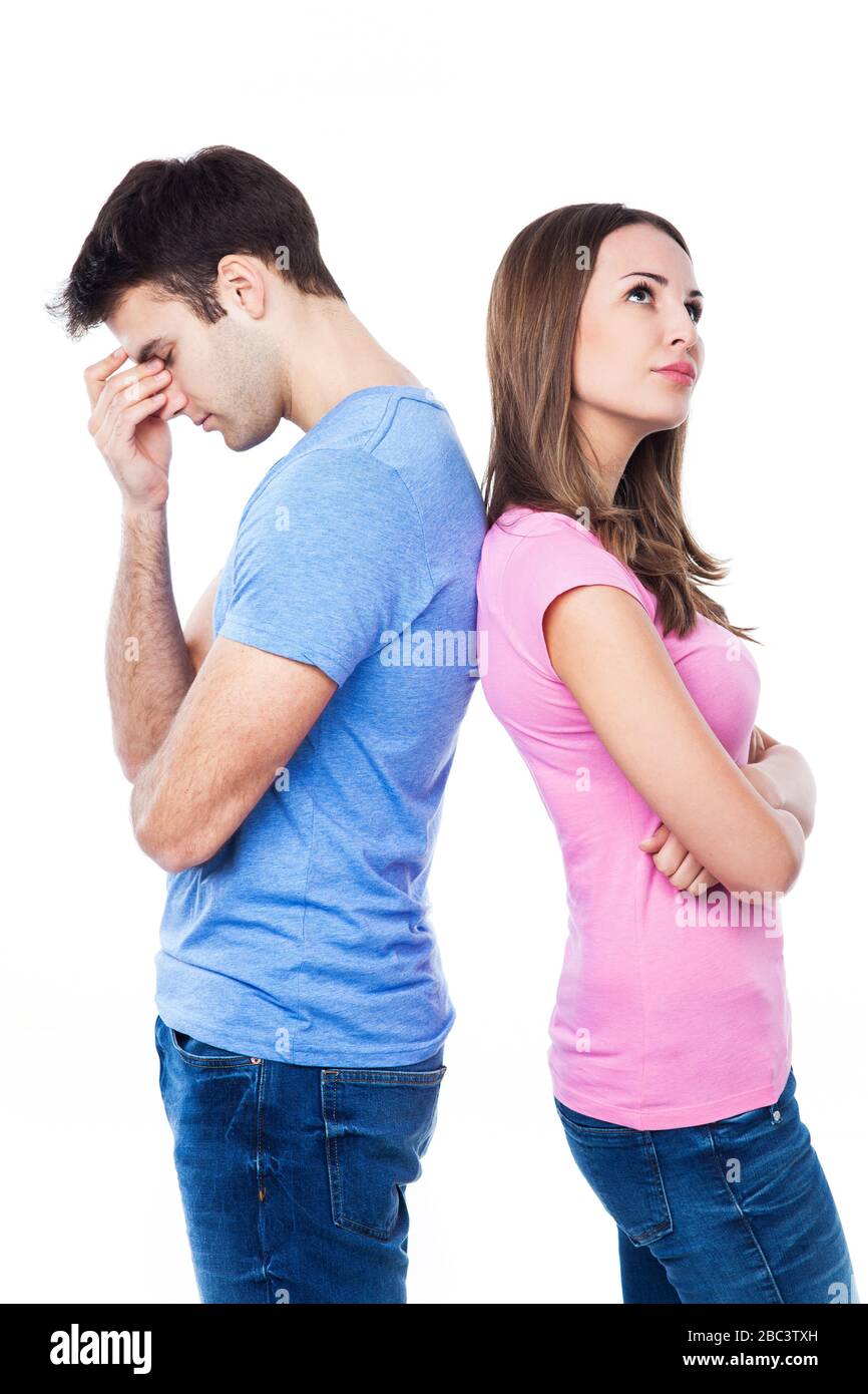 Unhappy couple standing back to back Stock Photo
