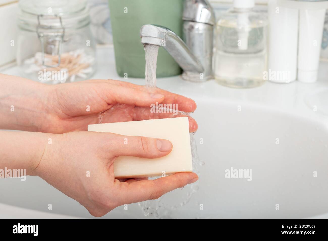 Woman washing hands with antibacterial soap and water. Hygiene concept ...