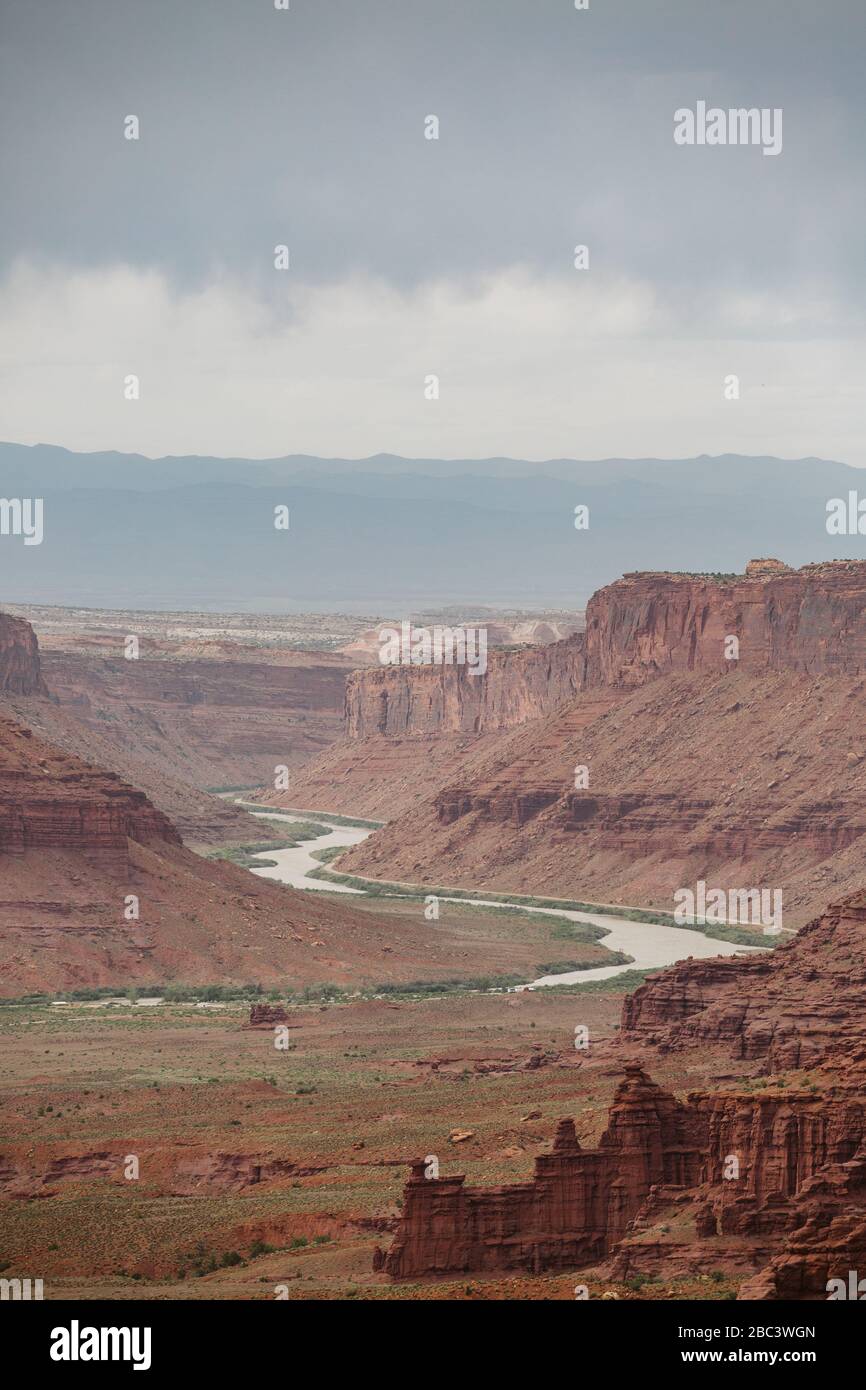 view of the colorado river under cloudy skies outside of moab utah Stock Photo