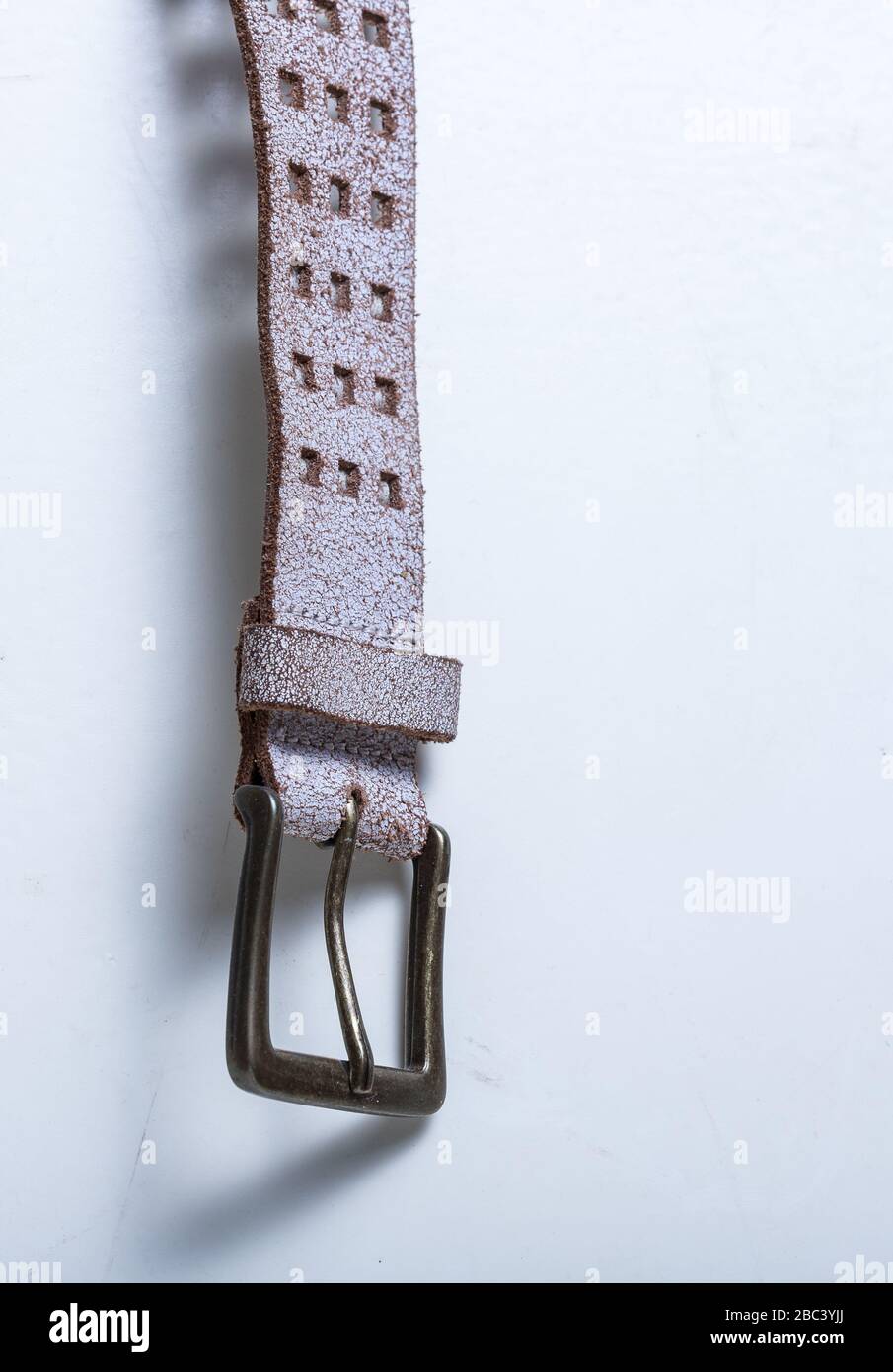 Leather belt on a white background. Element. Buckle. Stock Photo