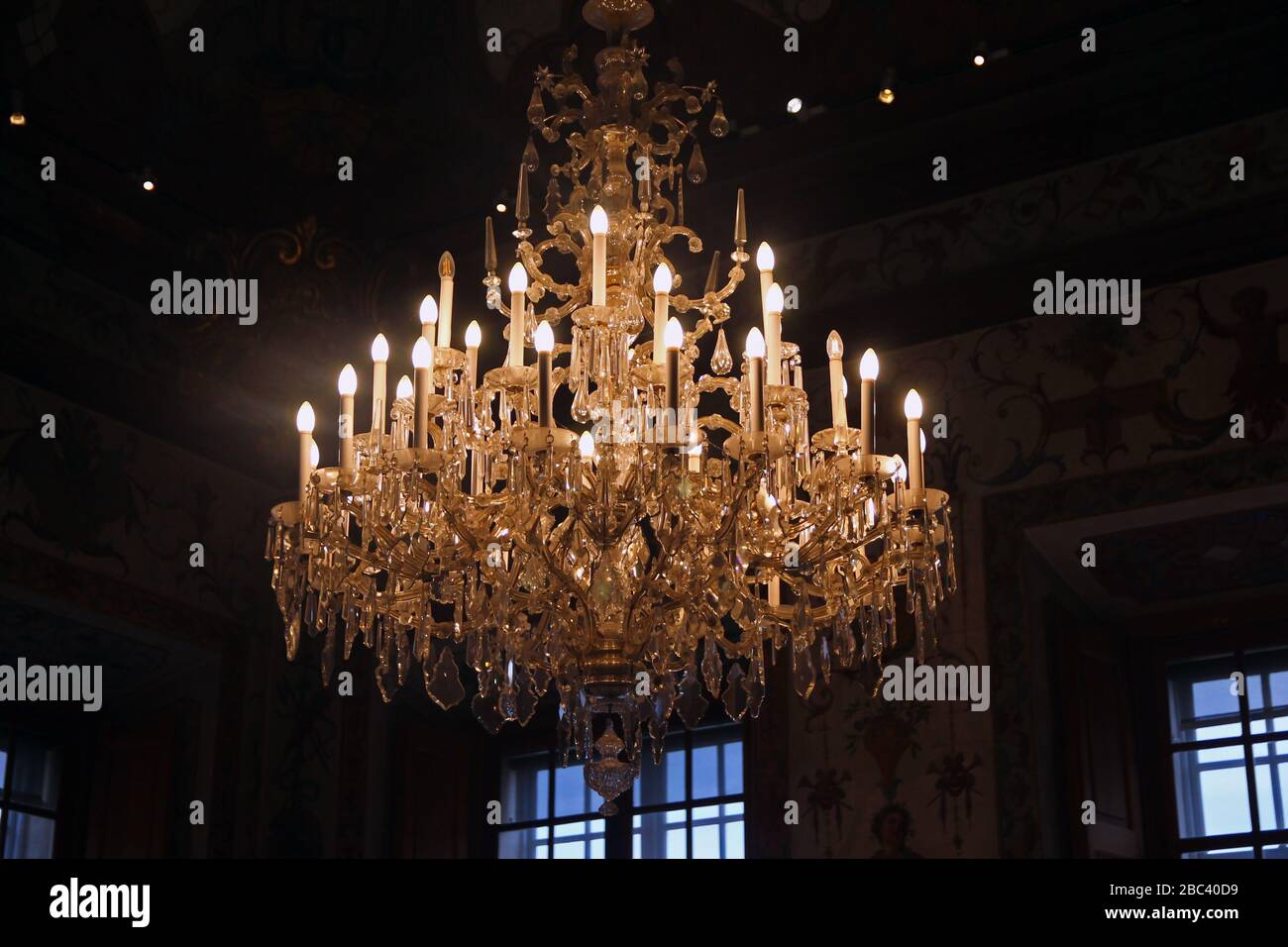 Historic pendant chandelier with lots of lights Stock Photo