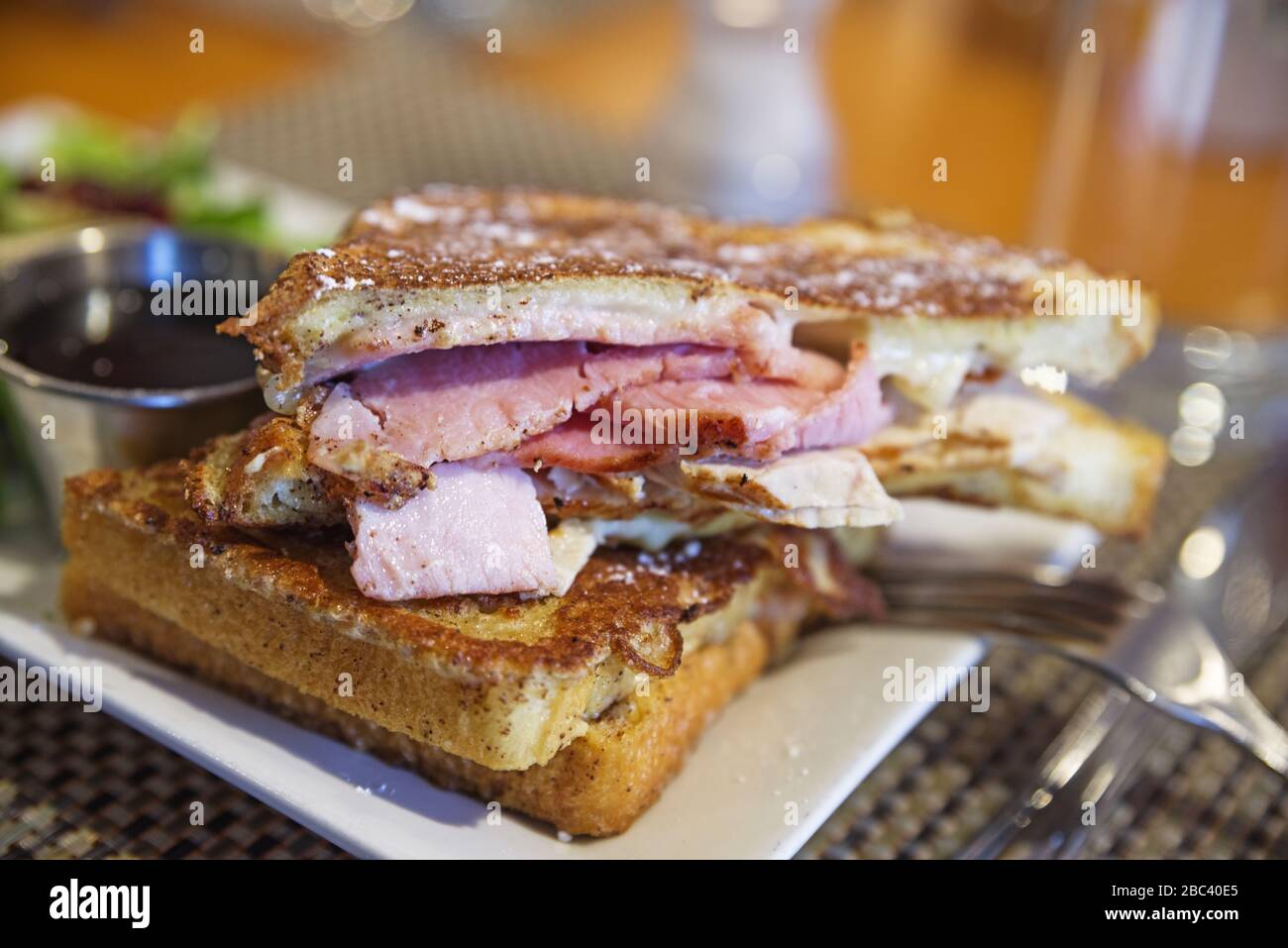 French toast ham and cheese sandwich on a plate with selective focus Stock Photo