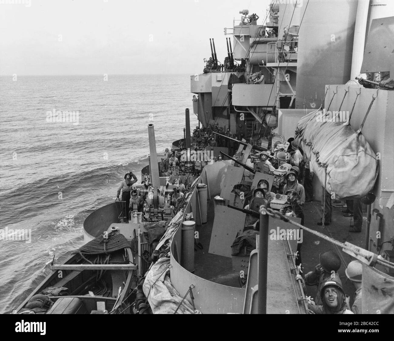 Gun crews aboard USS Phoenix (CL-46) during the Mindoro invasion, 18 December 1944 (80-G-47471). Stock Photo