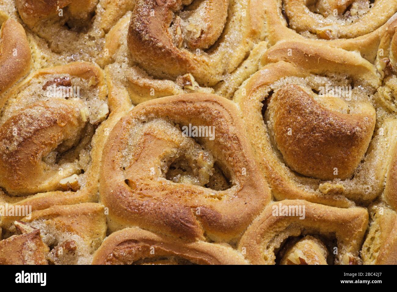 detail of a pan of homemade sticky bun rolls fresh out of the oven Stock Photo