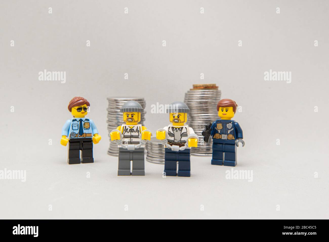 Florianopolis, Brazil, March 28, 2020: Police arresting bandits in the act. Thieves handcuffed and arrested by the police force. Selective focus. Lego Stock Photo