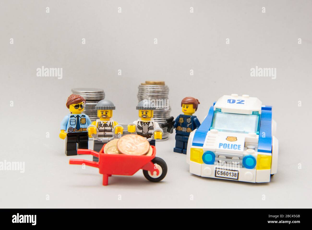 Florianopolis, Brazil, March 28, 2020: Police arresting bandits in the act. Thieves handcuffed and arrested by the police force. Selective focus. Lego Stock Photo