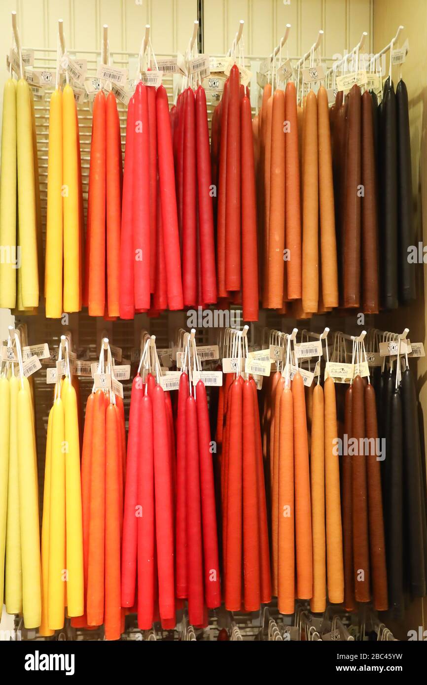 Yankee Candle Deerfield Ma 12/21/19 colorful taper hand dipped candles hanging from slat wall hooks Stock Photo