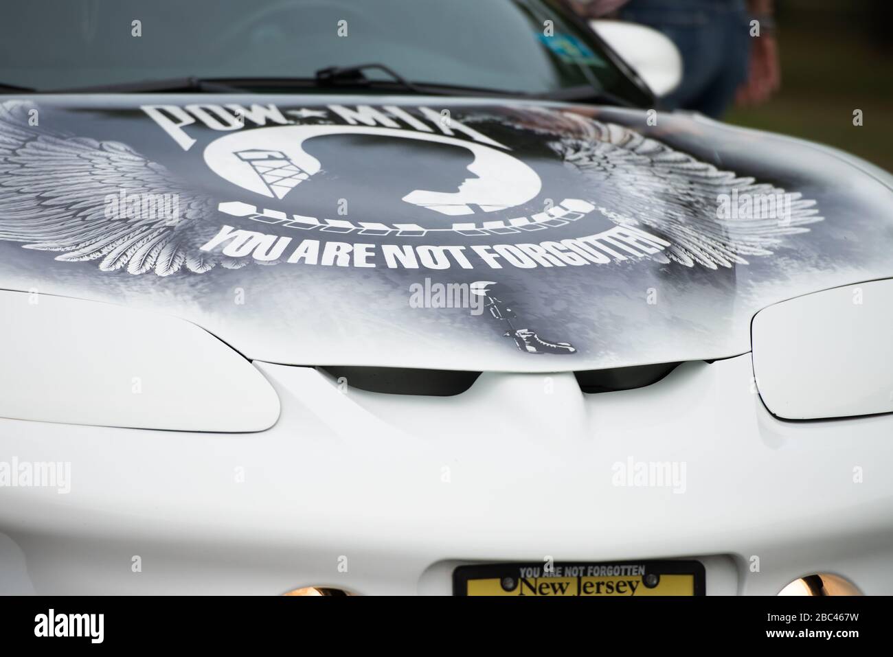 POW MIA and Never Forget painted on a white car in memory of those missing from the war. Stock Photo
