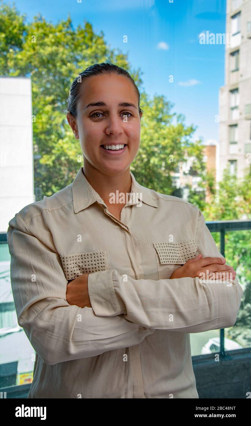 Female company leader looking at the camera Stock Photo - Alamy
