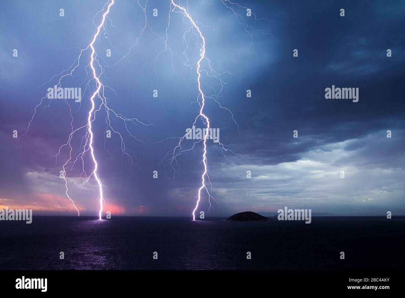 A double lightning strike into the ocean near The Gap, Albany, Australia Stock Photo