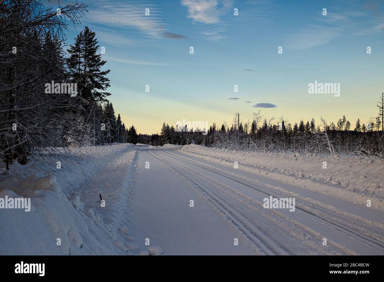 Winter road in Vasterbotten in northern Sweden. Stock Photo