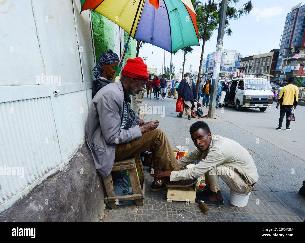 Polishing shoes at the Mercato market in Addis Ababa, Ethiopia. Stock Photo