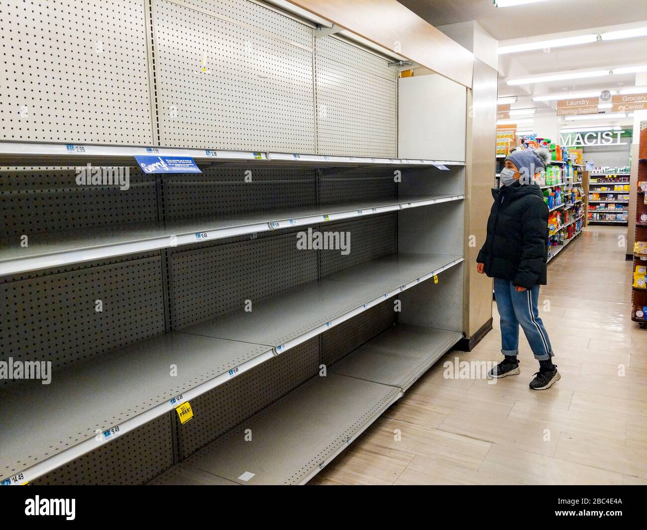 Empty Shelves Supermarket Toilet Paper Shortage Coronavirus COVID-19 Pandemic Stock Photo
