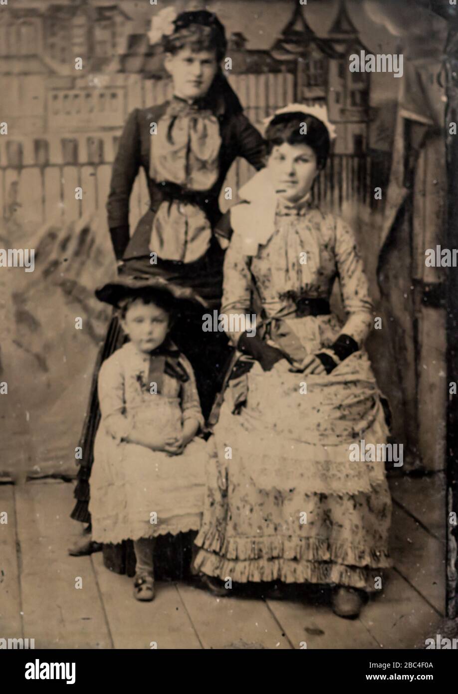 Antique tintype photo portrait of two women and a young girl Stock Photo