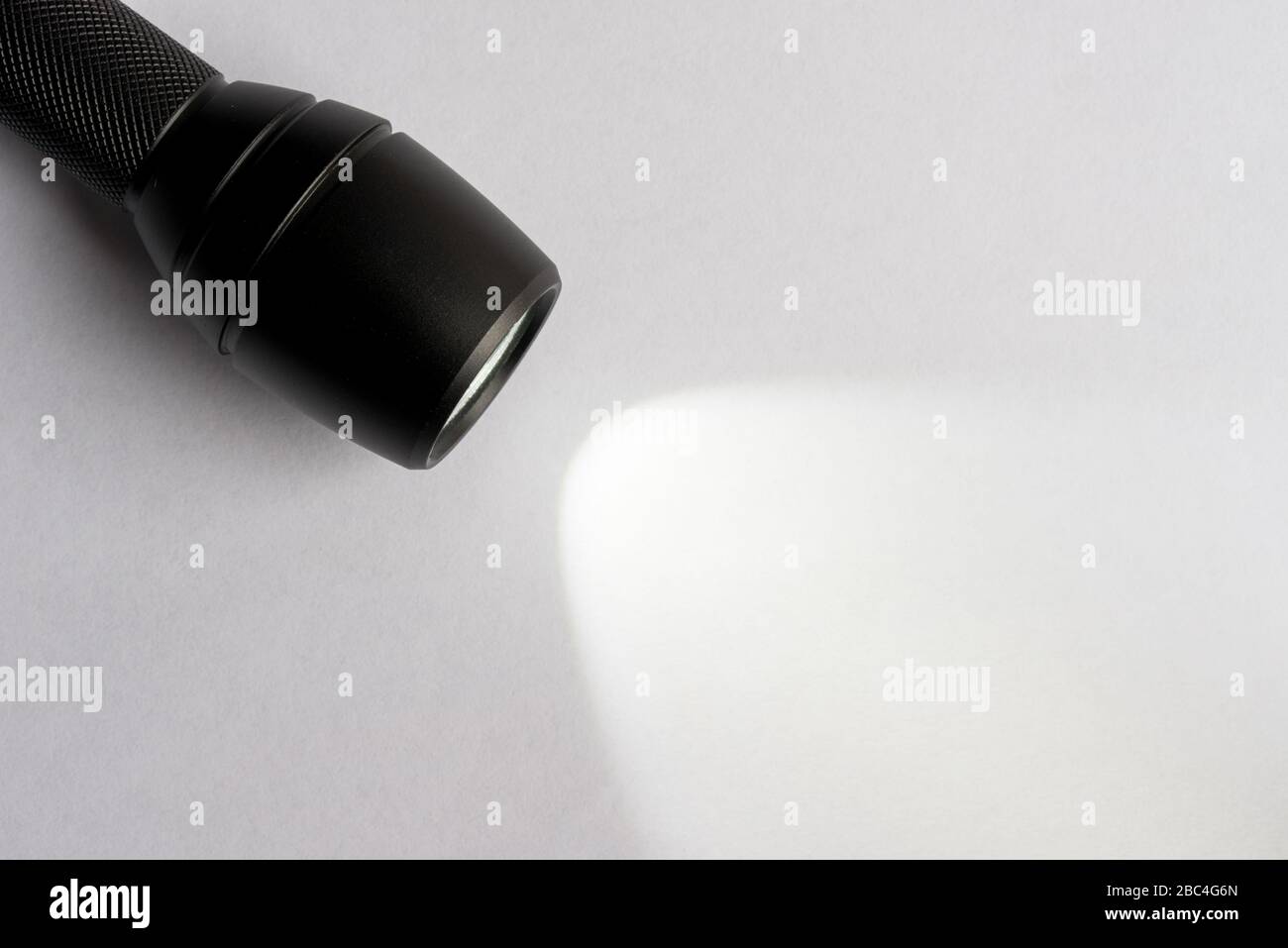 An Illuminated Handheld Flashlight Stock Photo Alamy
