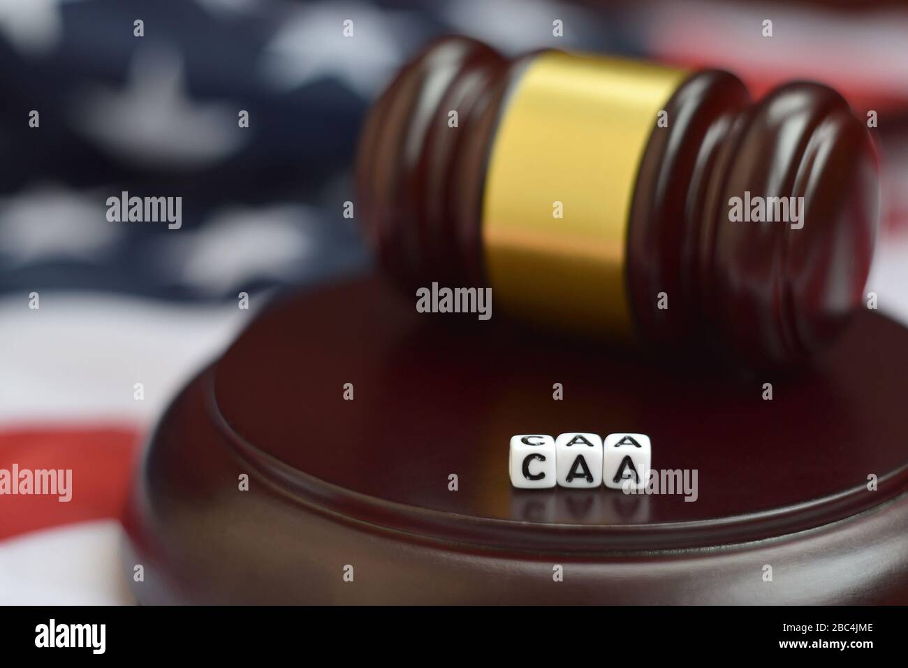 Justice mallet and CAA acronym close up. Cuban adjustment act Stock