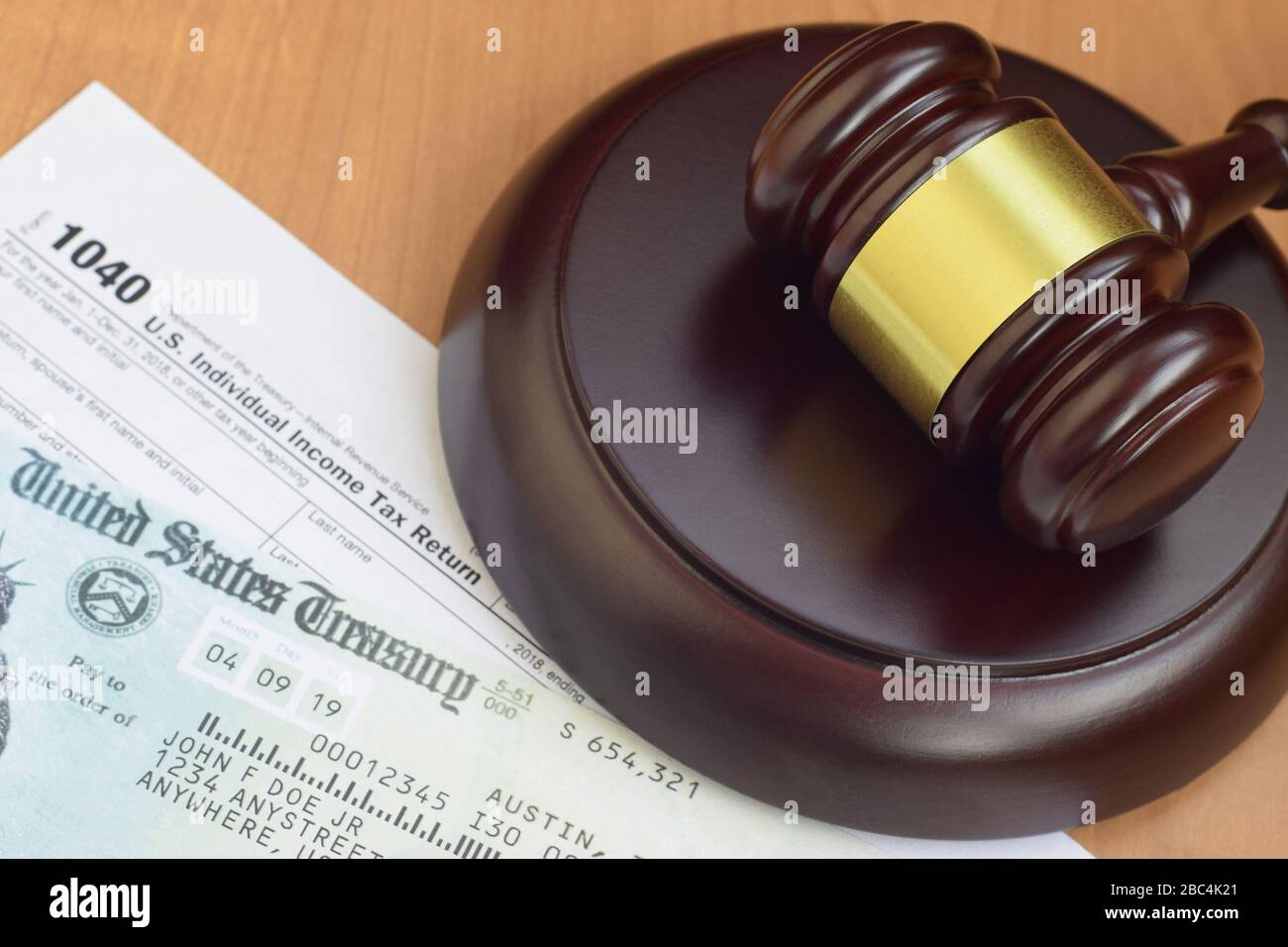 Justice mallet and 1040 IRS U.S. Individual tax return form and