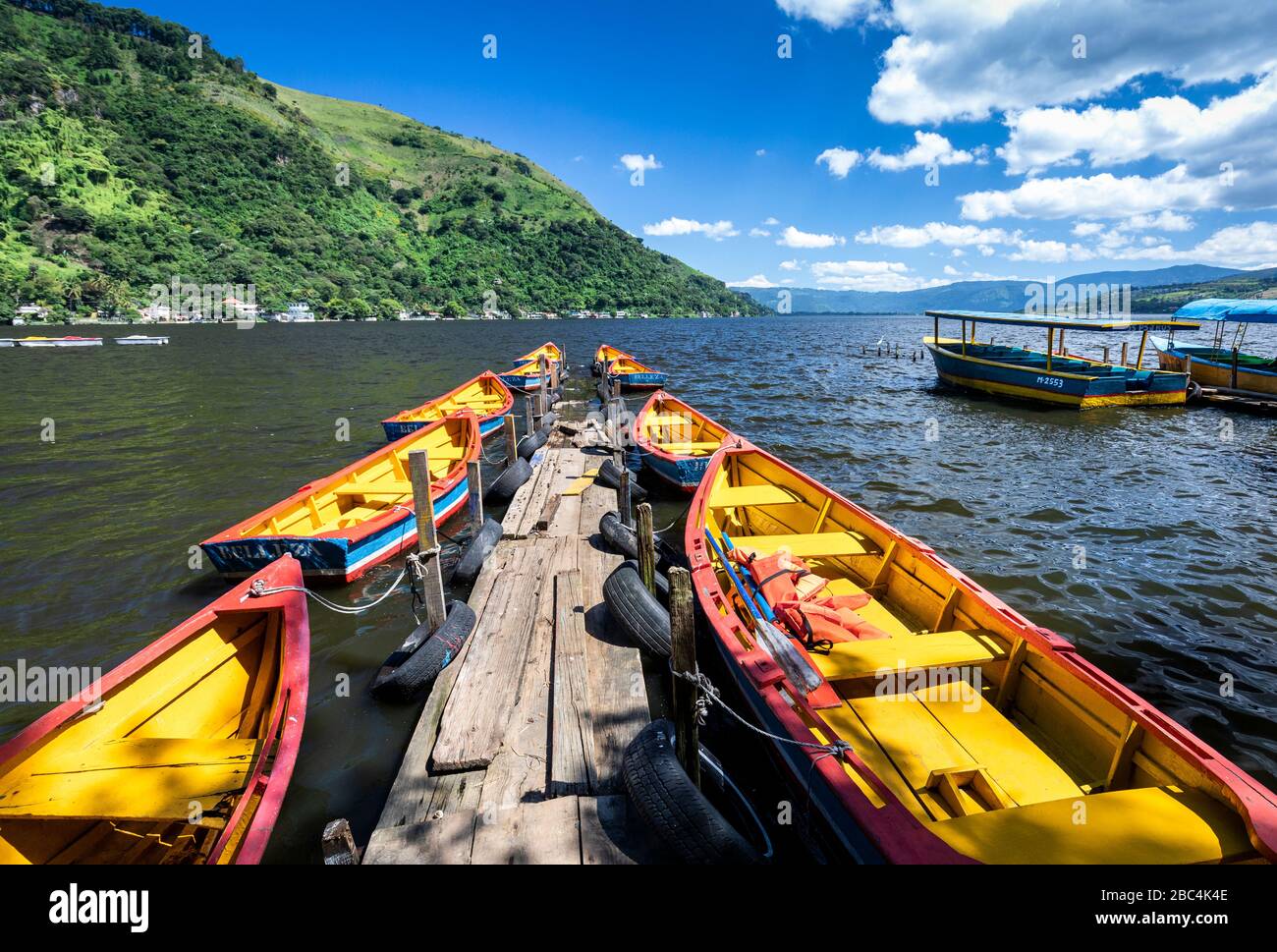 Boats line a dock on Lake Amatitlan, Guatemala. Stock Photo