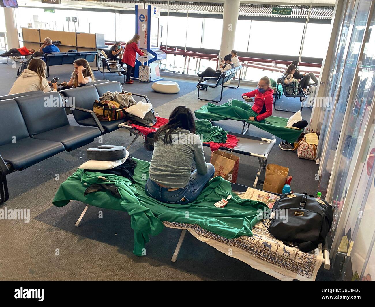 Travelers find themselves trapped at the airport as countries shut down and airlines reduce their flight operations  amid an outbreak of the new corona virus COVID-19. The World Health Organization (WHO) declared COVID-19 a pandemic, globally widespread on March 11. Stock Photo