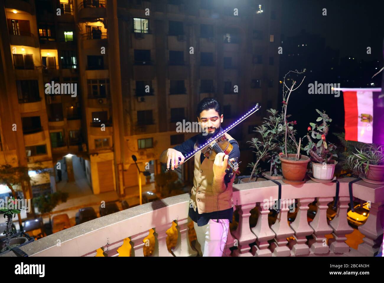 Beijing, Egypt. 31st Mar, 2020. Egyptian violinist Mohammed Adel plays the violin during his