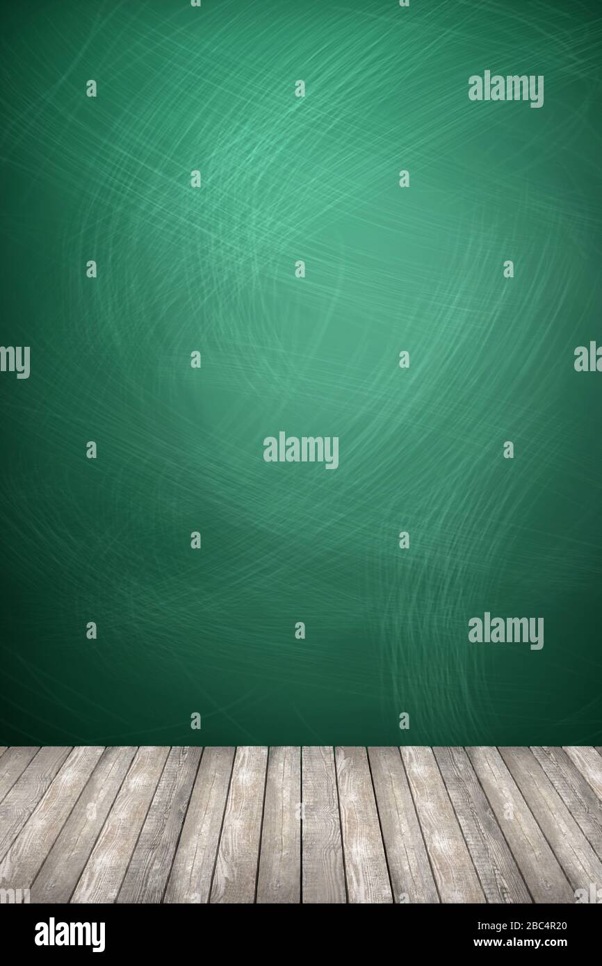 Rubbed out chalk on a greenboard, wooden floor Stock Photo