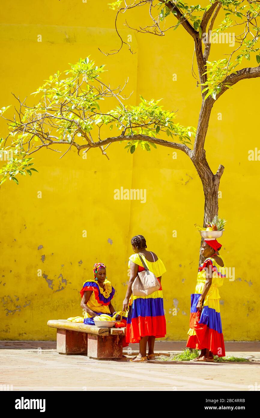 Palenqueras group, Palenqueras are women who sell fruits and wear very colorful clothes. They are of ancestry from the African slaves Stock Photo
