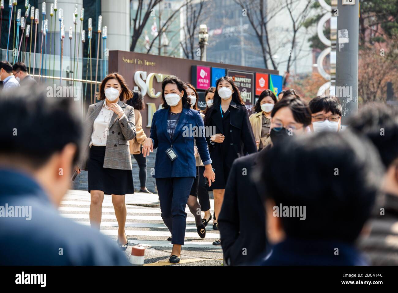 People on their way to work wearing masks during the Coronavirus pandemic, Seoul, South Korea