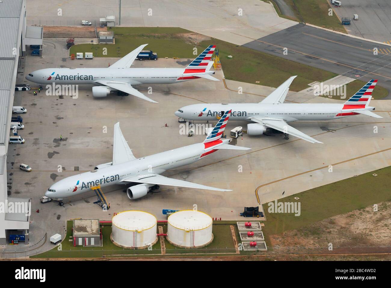American Airlines Boeing 777 parked in front of the hangar. New facility for maintenance in Sao Paulo, Brazil. Grounded aircraft nowadays. Stock Photo