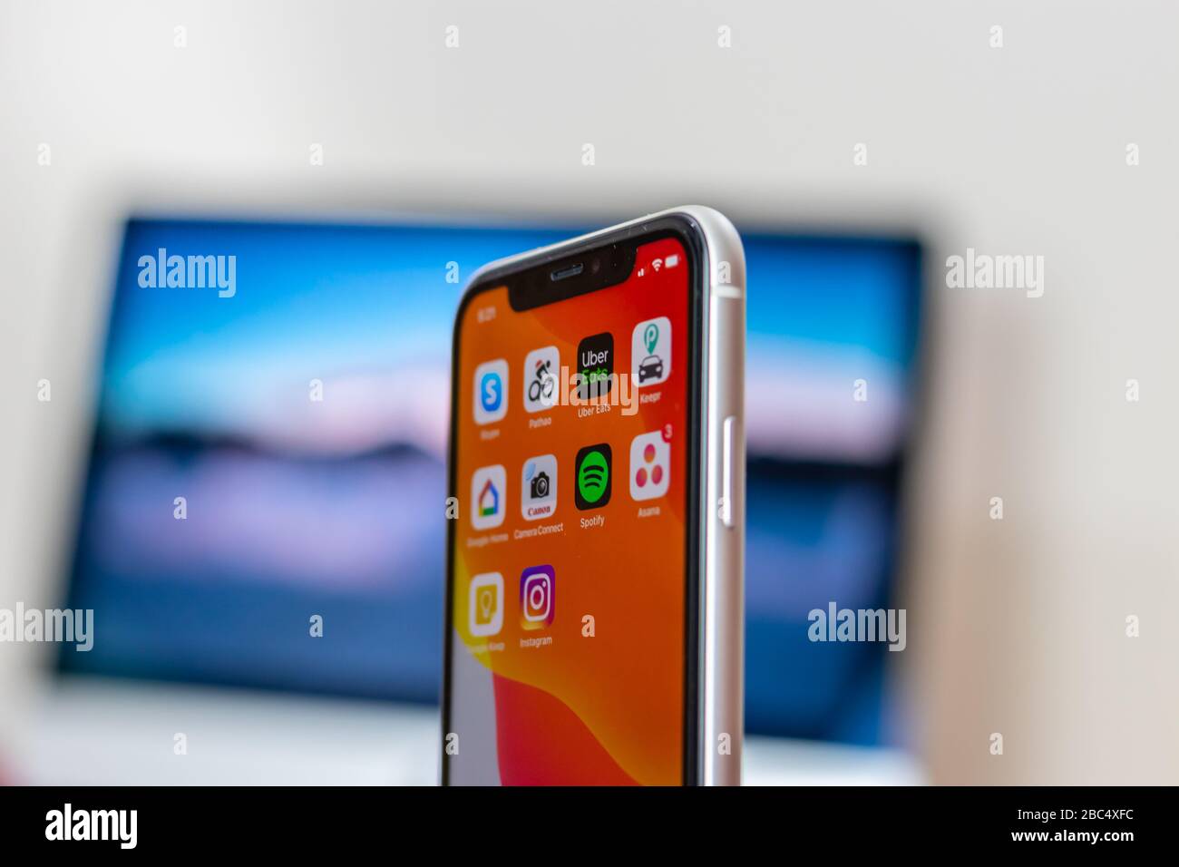 Backside of iPhone 11 white variant holding on hand Stock Photo Alamy