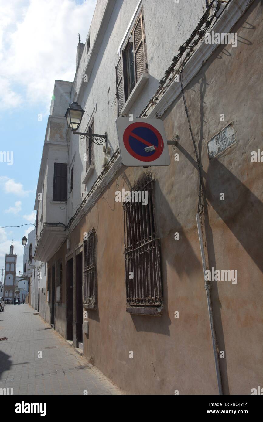 Narrow street and the exterior of some grand homes in the historic