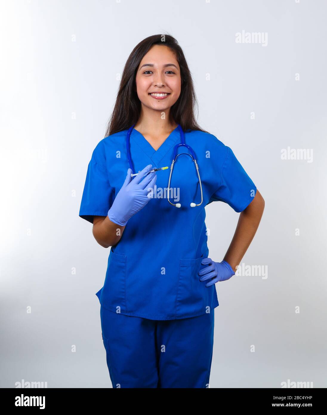 Woman in blue medical scrubs hi-res stock photography and images - Alamy