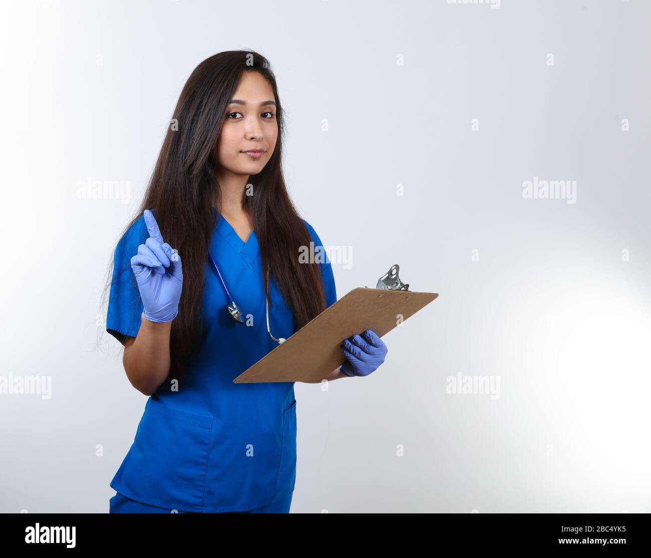 Young nurse in blue hi-res stock photography and images - Alamy