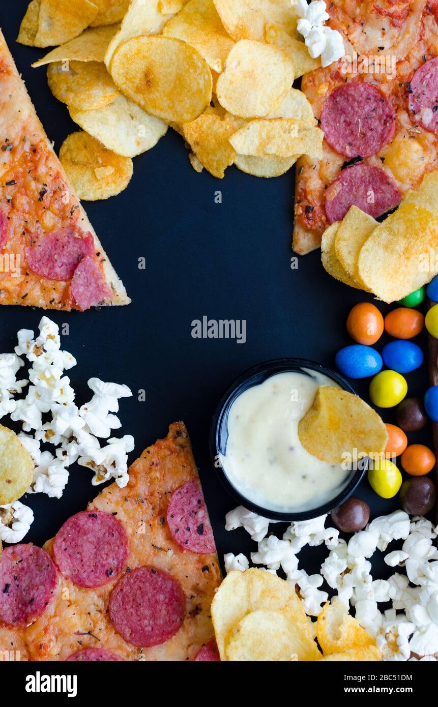 Fast food and unhealthy eating concept. Close up of fastfood snacks