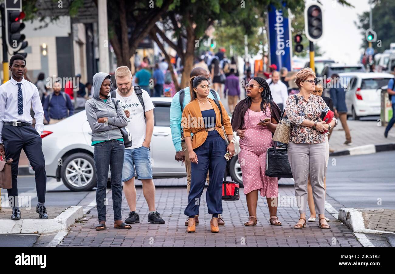 Johannesburg, South Africa 18th February - 2020: Pedestrians crossing road in city centre Stock Photo