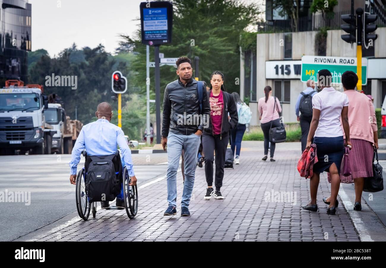 Johannesburg, South Africa 18th February - 2020: Pedestrians crossing road in city centre Stock Photo