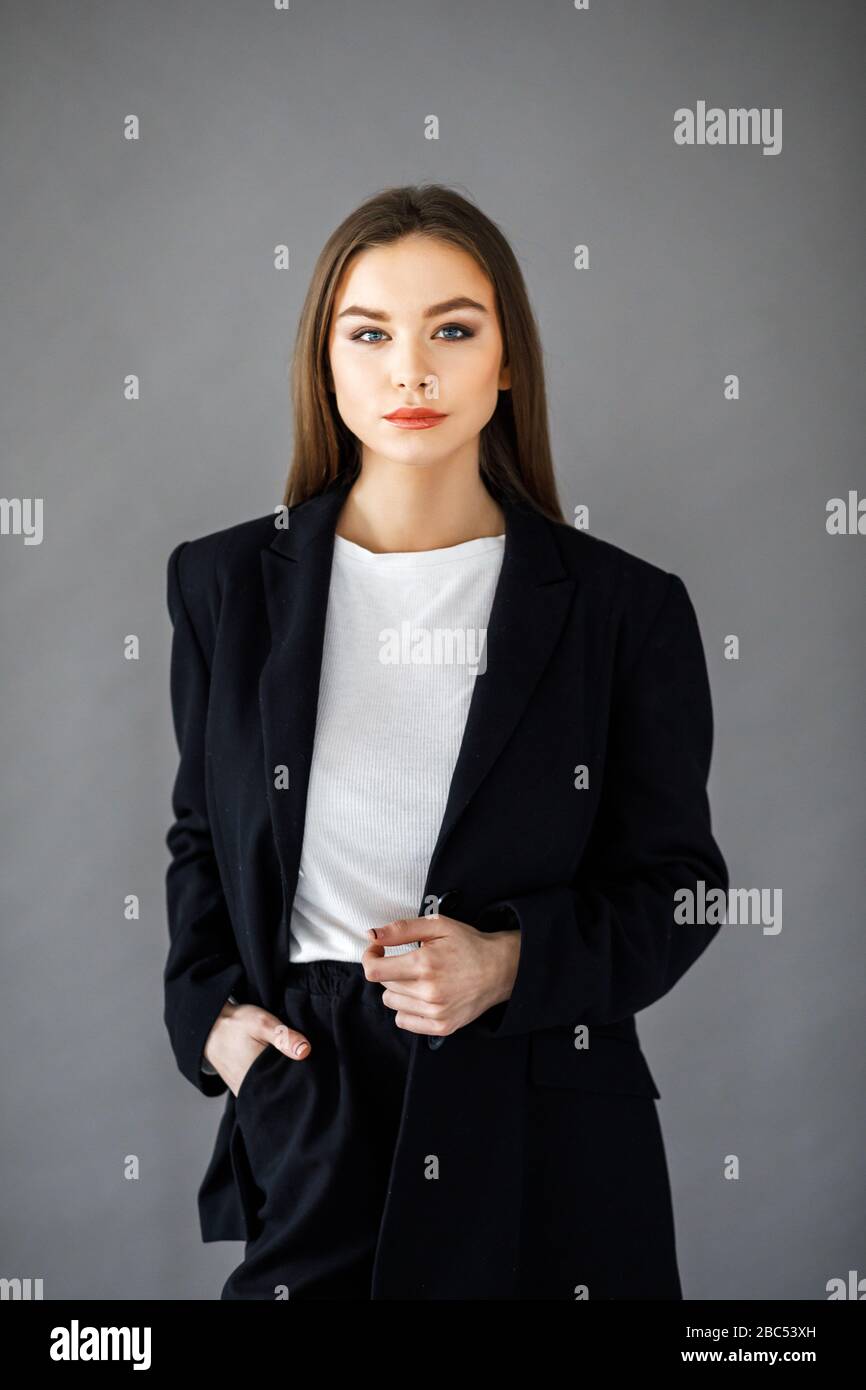 Portrait of beautiful business woman, isolated on grey background Stock ...