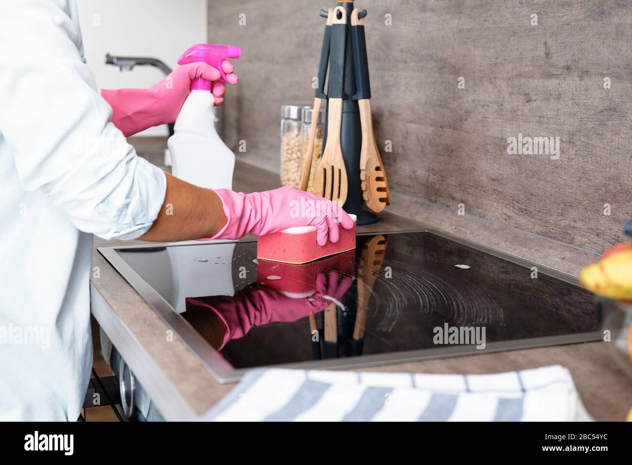 Cleaning Induction Hob. Cleaning service concept Stock Photo Alamy