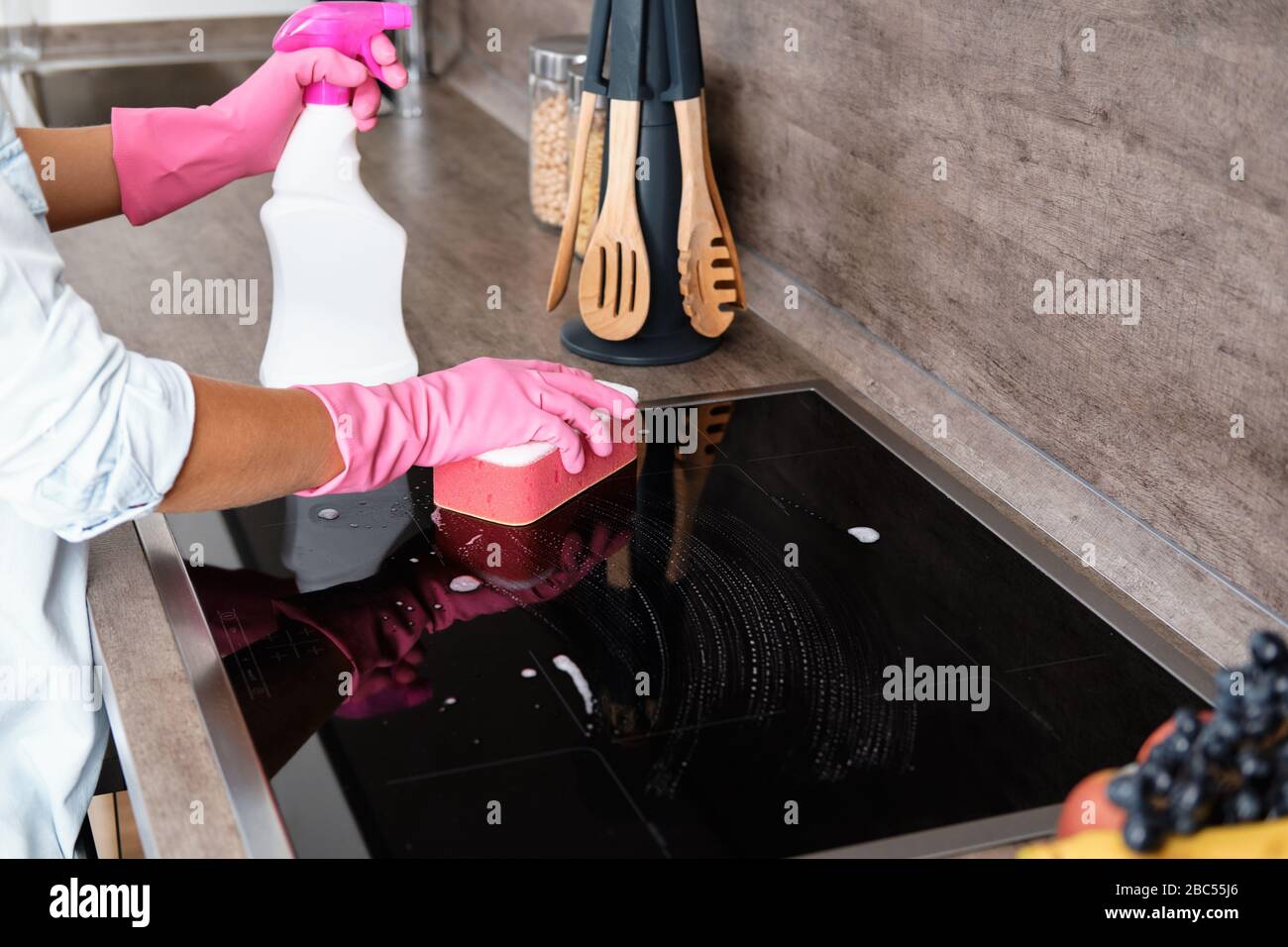 Cleaning Induction Hob. Cleaning service concept Stock Photo Alamy
