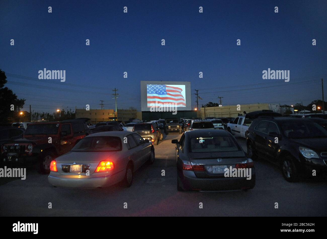 Lakeland, United States. 03rd Apr, 2020. April 2, 2020 - Lakeland, Florida, United States - The show begins at the Silver Moon drive-in theatre in Lakeland, Florida on April 2, 2020, the last night of operation before the state-wide stay-at-home order issued by Florida Governor Ron DeSantis to curb the spread of coronavirus takes effect. The two-screen Silver Moon, the last remaining drive-in of Polk County, Florida, has seen an increase in business since the COVID-19 pandemic forced the closure of indoor theaters. Credit: Paul Hennessy/Alamy Live News Stock Photo