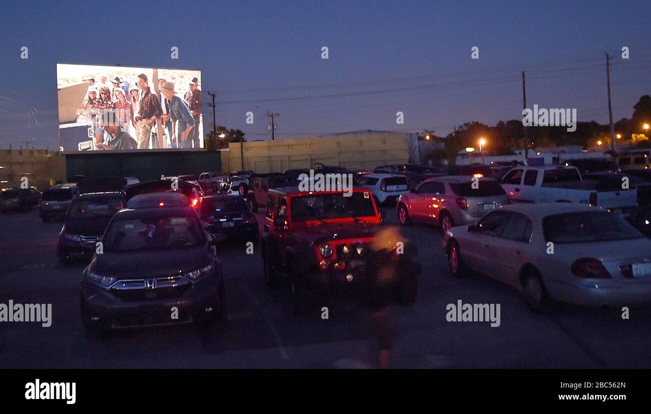 Lakeland, United States. 02nd Apr, 2020. April 2, 2020 - Lakeland, Florida, United States - A film plays at the Silver Moon drive-in theatre in Lakeland, Florida on April 2, 2020, the last night of operation before the state-wide stay-at-home order issued by Florida Governor Ron DeSantis to curb the spread of coronavirus takes effect. The two-screen Silver Moon, the last remaining drive-in of Polk County, Florida, has seen an increase in business since the COVID-19 pandemic forced the closure of indoor theaters. Credit: Paul Hennessy/Alamy Live News Stock Photo