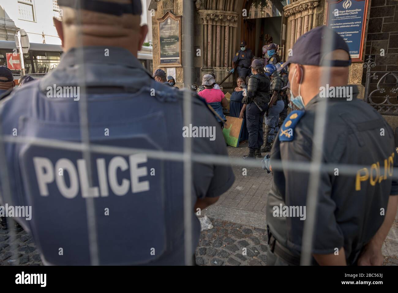 Police evict refugees from Cape Town's Central Methodists Church in South Africa after a six month occupation protesting against xenophobia Stock Photo