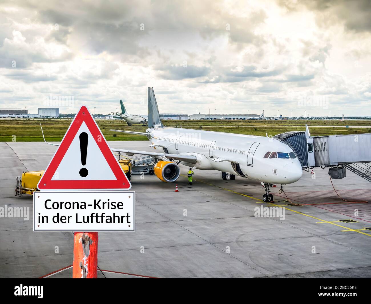 Corona crisis warning sign in aviation in german Stock Photo