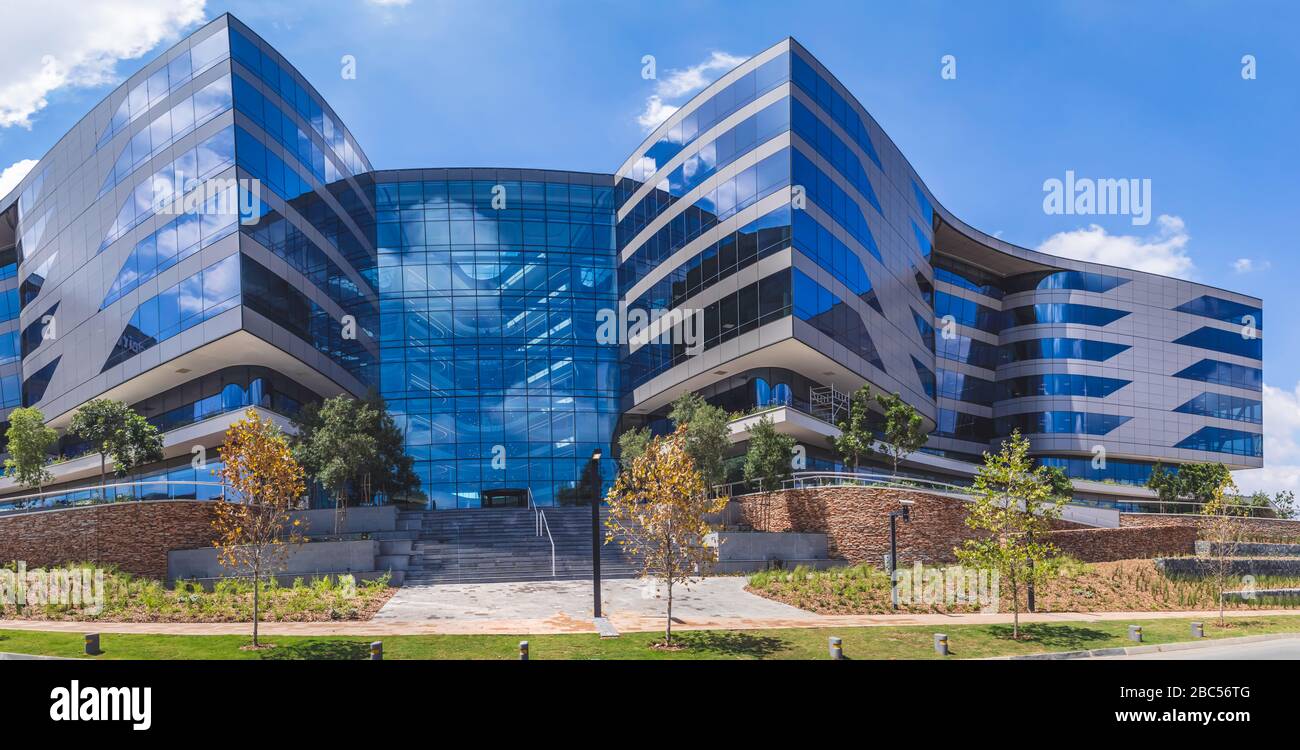 Johannesburg, South Africa,14th March - 2020: Exterior of modern office building with glass facade. Stock Photo