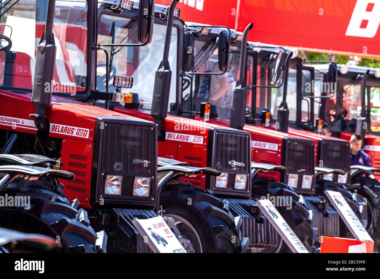 Novi Sad, Serbia: may 9. 2015 - Novi Sad Agro fair with people and Fair show. Modern tractors and harvester on display on Agricultural fair Stock Photo