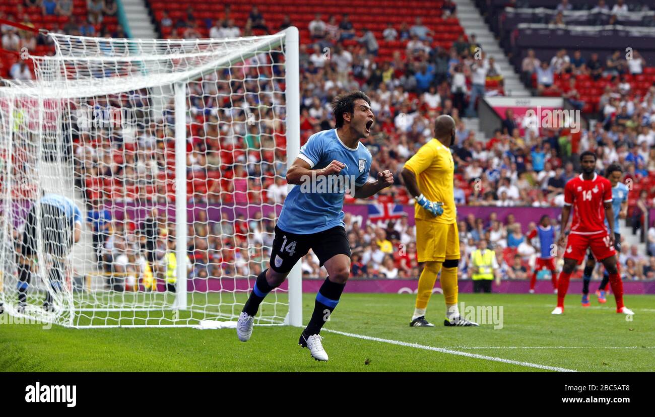 Uruguay's Nicolas Lodeiro scores his sides second goal during the UAE v Uruguay, Mens Football, First Round, Group A match at Old Trafford, Manchester. Stock Photo