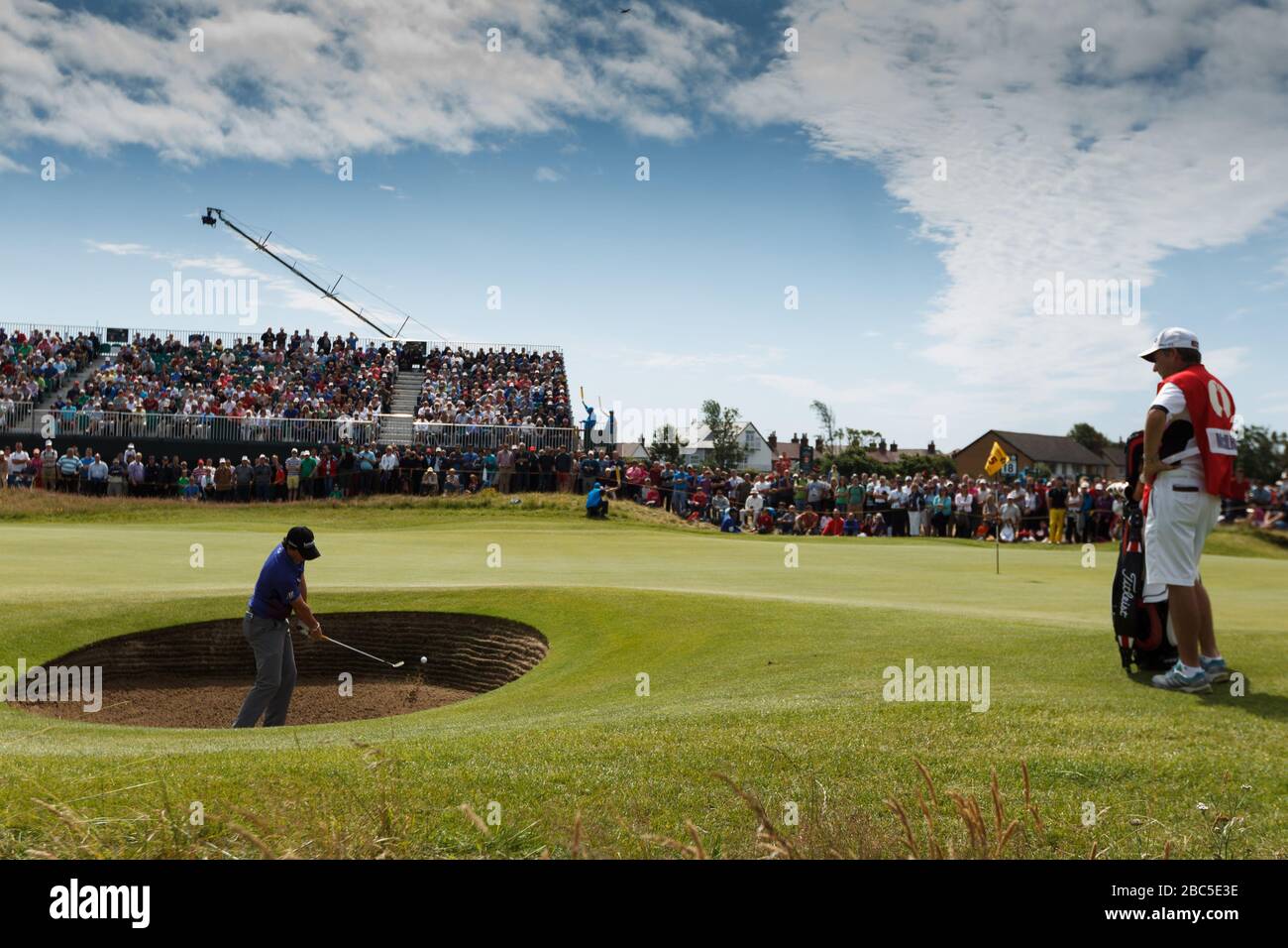 Rory McIlroy holes his bunker shot on the 15th Stock Photo