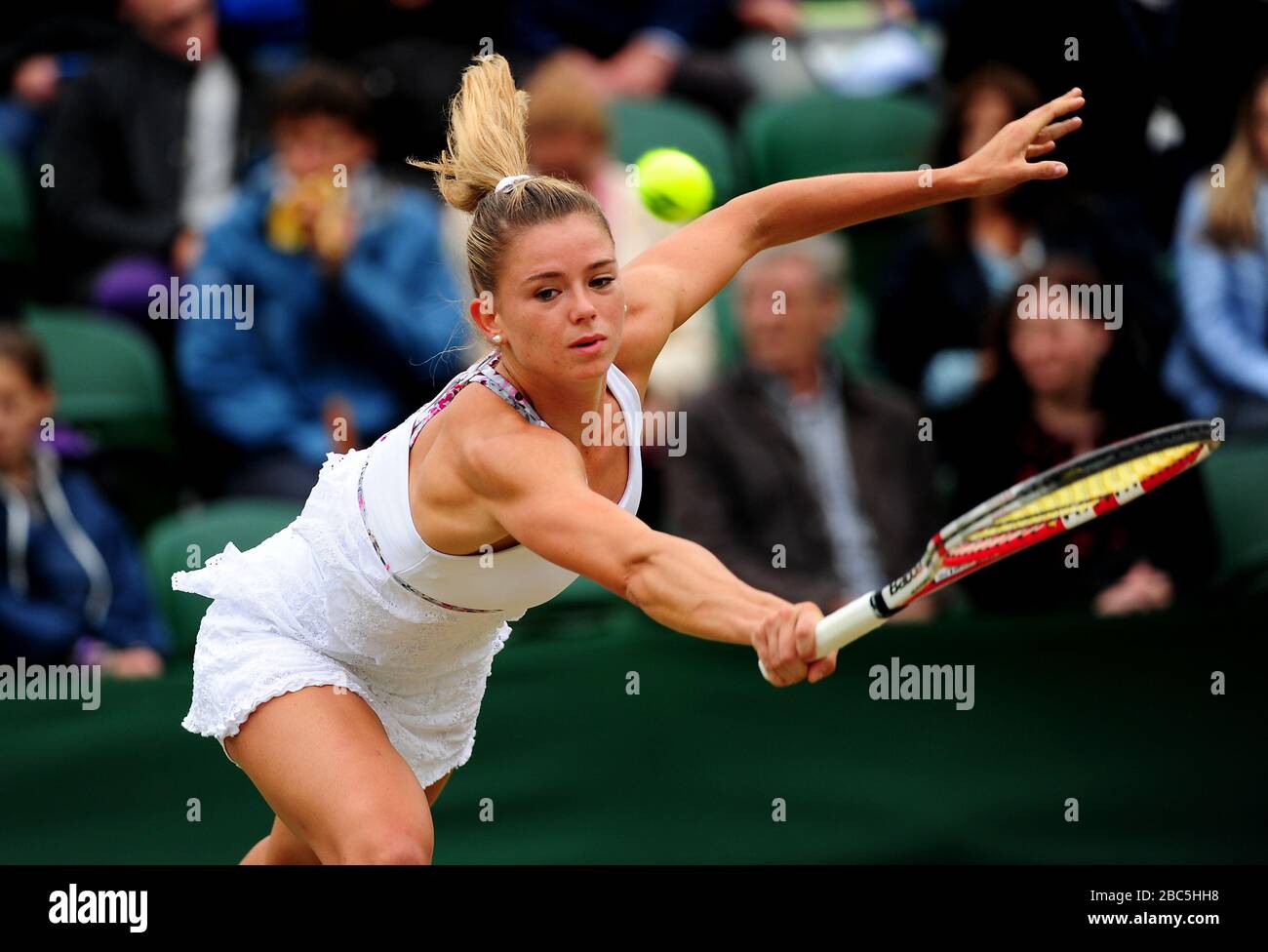 Italy's Camila Giorgi in action against Poland's Agnieszka Radwanska Stock Photo