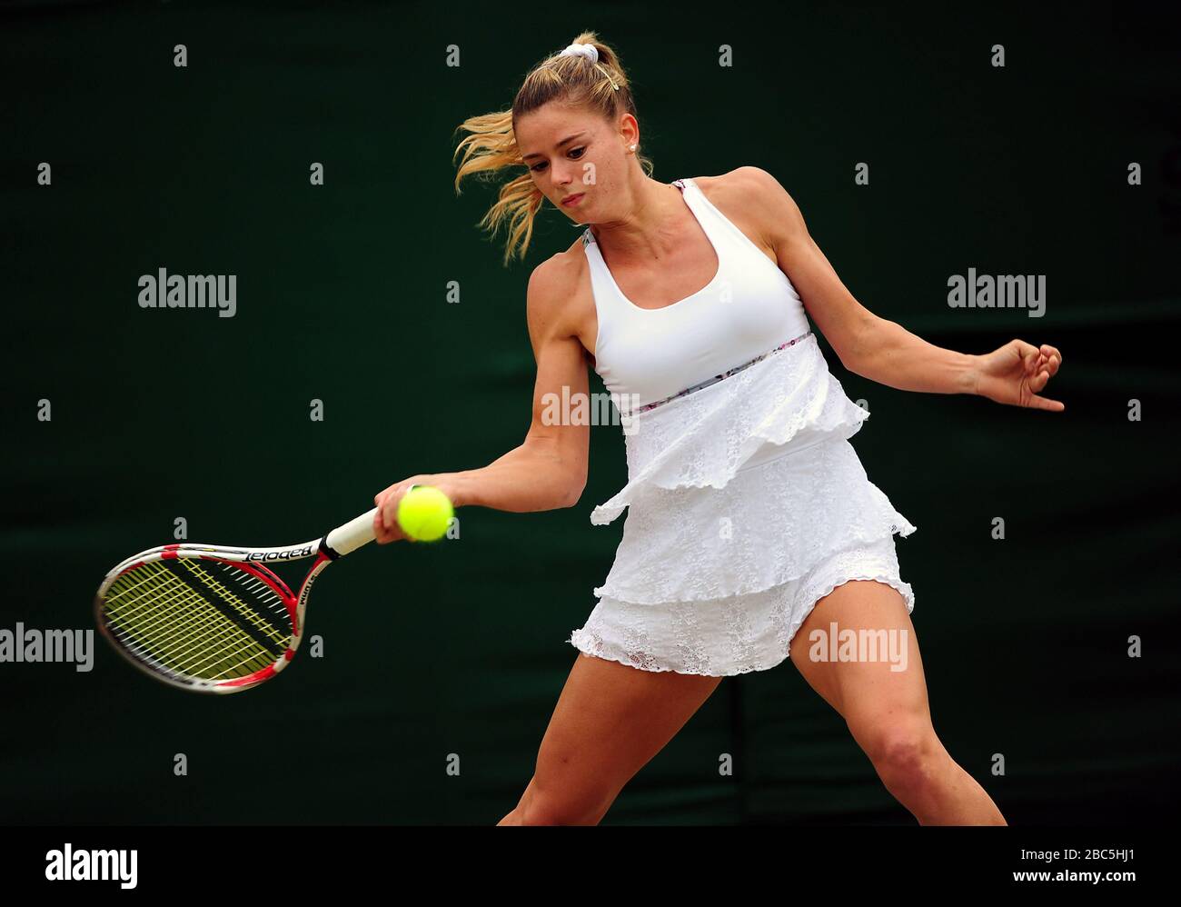 Italy's Camila Giorgi in action against Poland's Agnieszka Radwanska Stock Photo