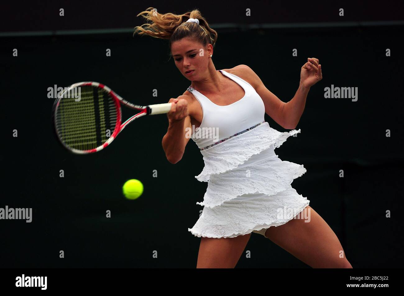 Italy's Camila Giorgi in action against Poland's Agnieszka Radwanska Stock Photo
